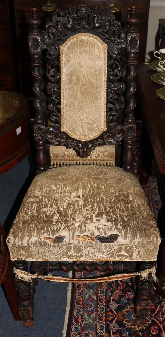 A set of six Carolean style oak dining chairs